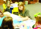 Cotton Blossom Savanna Hatten does Community Service at Richland Parish Library in Rayville. She helped the children with their arts and crafts and listened to the story time. She attends Delhi Charter School.